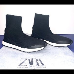 Sock style high top sneakers.